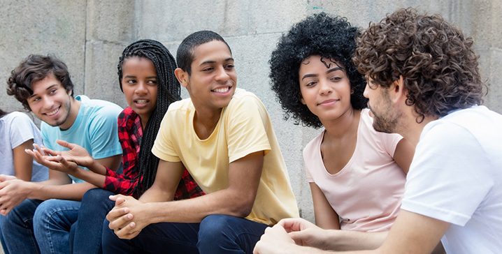 youth sitting outside talking