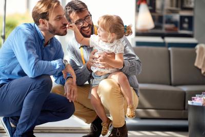 parents holding child