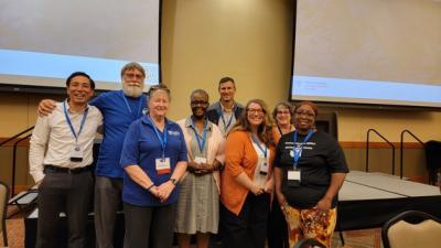 From left to right: Taku Mineshita, Mike Canfield, Mary McGauhey, Natalie Green, Ron Effland, Holly Luna, Melanie Meyer, Jazz Dozier