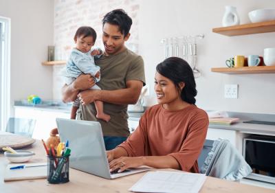 Young couple with toddler at computer