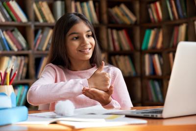 Girl using asl to sign help