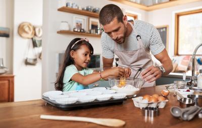 Dad and daughter cooking in the kitchen