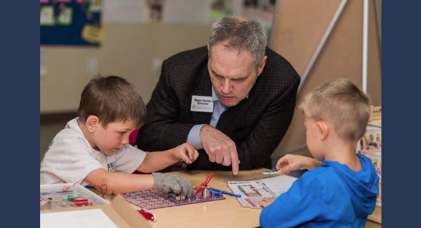 Ross at table with kids