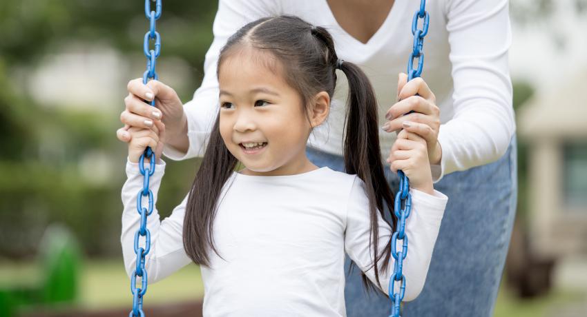 Young girl on swing