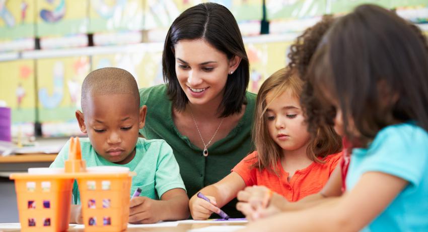 Preschool teacher with students