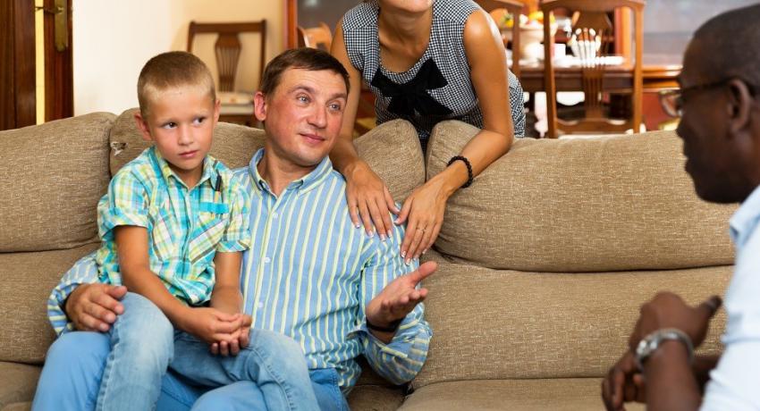 Family consulting with a child welfare worker. 