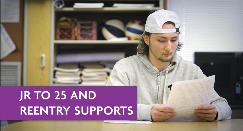 Young male resident of Juvenile Rehabilitation reads at a table. 