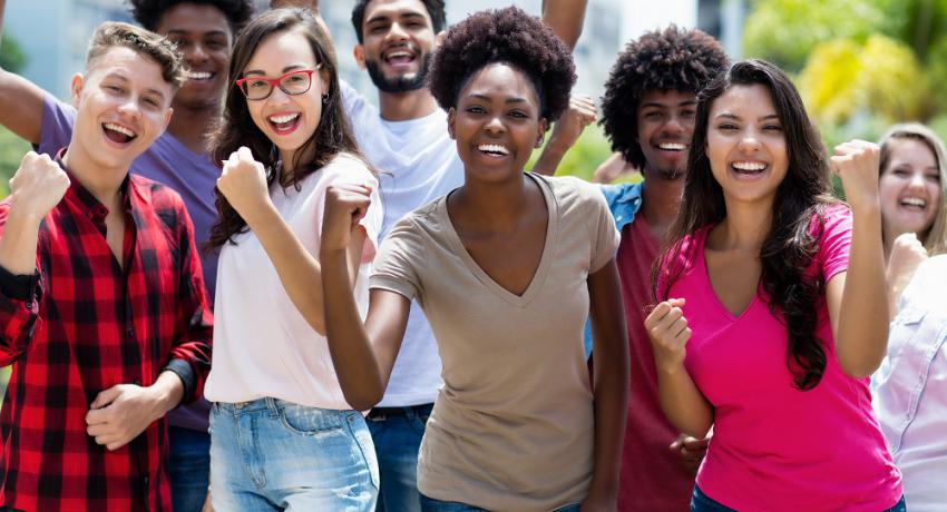 Group of cheering multi-racial young adults