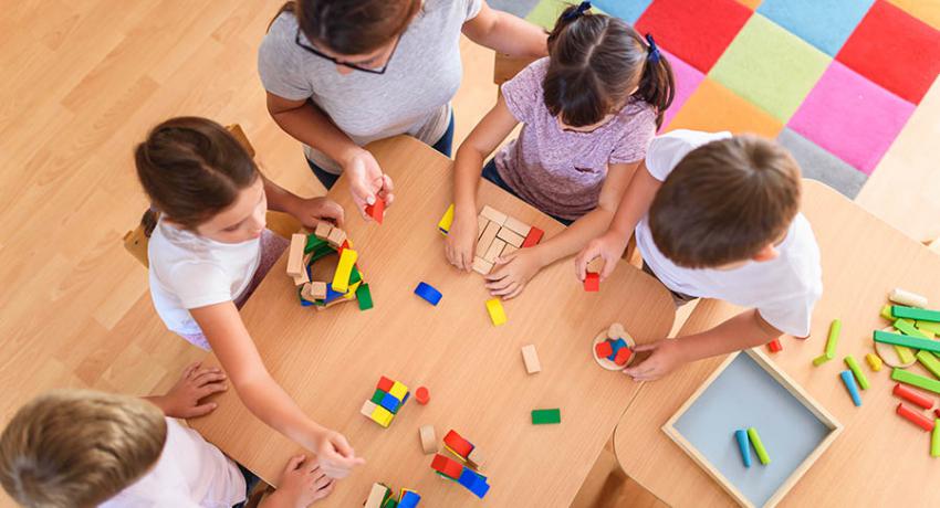 children in daycare at table