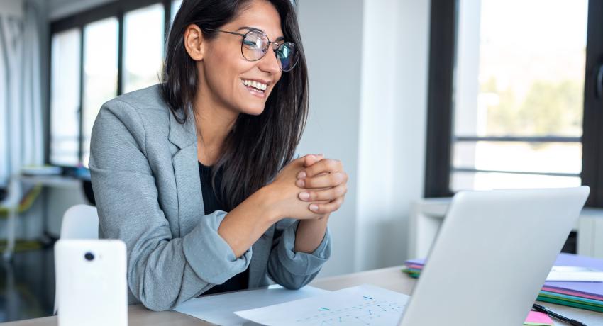 Women attending a meeting online. 