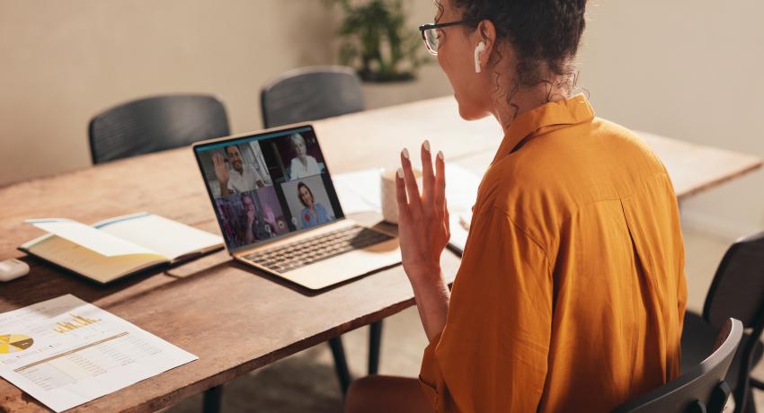 Women attending a meeting online. 