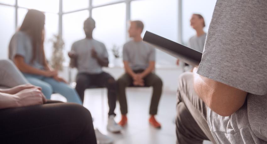 Youth sitting in chairs in a circle